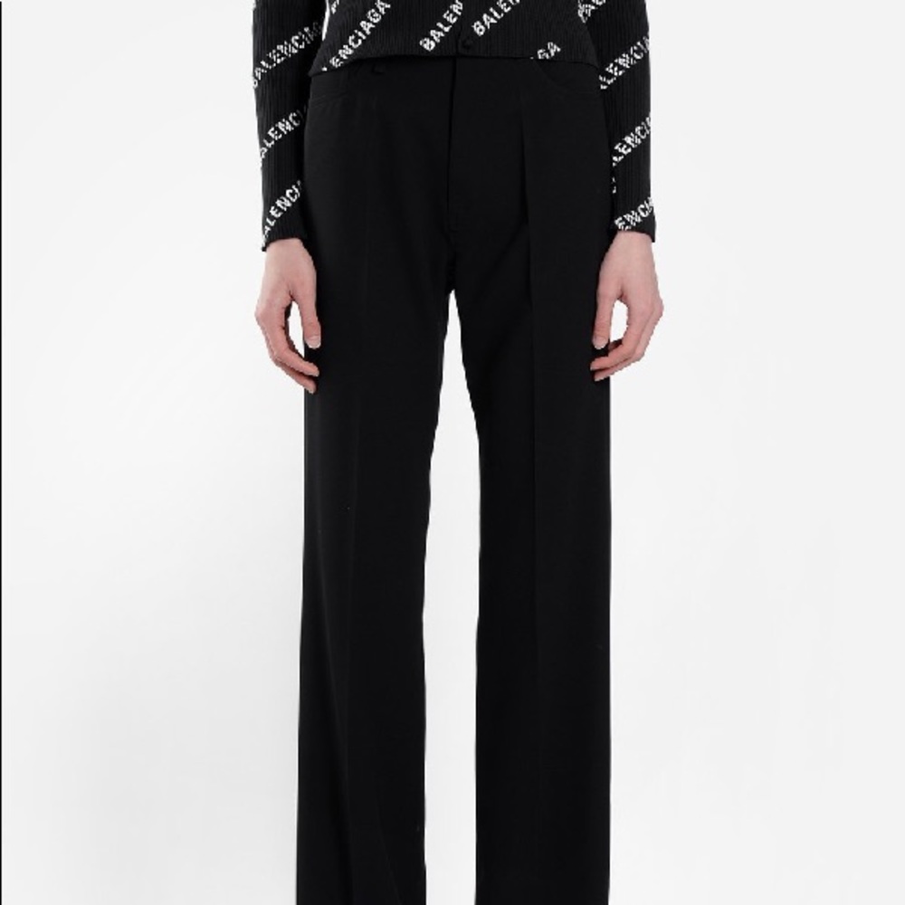 BALENCIAGA BLACK WOOL FLARE PANTS .